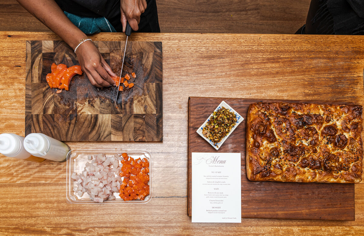 A printed menu and prepped ingredients laid out for recipe development