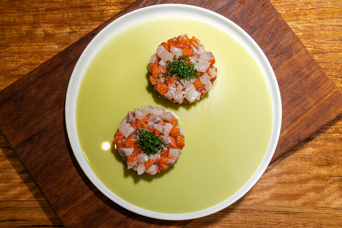Salmon crudo plated for a private dining course
